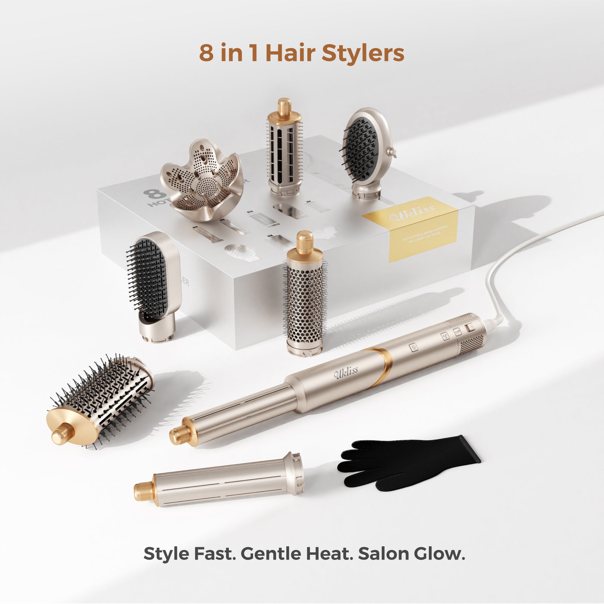 An 8-in-1 hair styler set displayed on a clean white background, featuring a metallic gold and silver styler with multiple attachments, a round brush, a barrel brush, a black glove, and a small display stand. Text at the top reads '8 in 1 Hair Stylers' and text at the bottom reads 'Style Fast.